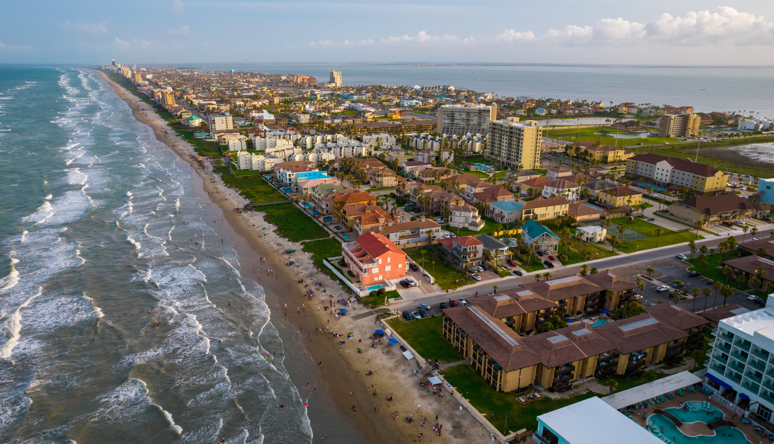 aerial drone views above South Padre Island , Texas , USA at Port Isabel with beach front condos and hotels and travel resort destination of South Texas
